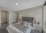 Thumbnail 43 of 105 - a bedroom with a bed and a closet