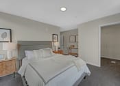 Thumbnail 39 of 105 - a bedroom with a large bed and a closet