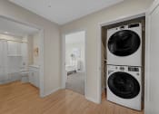 Thumbnail 37 of 105 - a washer and dryer in a living room with a bathroom and a bedroom