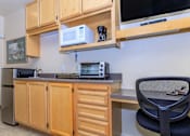 Thumbnail 1 of 23 - A Kitchen With Wooden Cabinets at Atrium Garden Apartment Homes, LLC, California