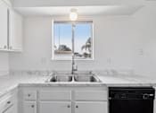Thumbnail 38 of 45 - Kitchen with window at Ocean Villas Apartments, Oxnard