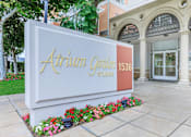 Thumbnail 18 of 23 - A White Sign With Gold Lettering at Atrium Garden Apartment Homes, LLC, San Jose, 95112