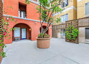 Thumbnail 15 of 23 - A Courtyard With a Planter In The Middle at Atrium Garden Apartment Homes, LLC, California, 95112