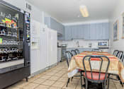 Thumbnail 13 of 23 - A Kitchen With a Table And Chairs at Atrium Garden Apartment Homes, LLC, San Jose