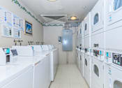 Thumbnail 2 of 23 - A Row Of Washing Machines at Atrium Garden Apartment Homes, LLC, California