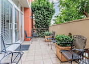 Thumbnail 6 of 23 - A Patio With a Table at Atrium Garden Apartment Homes, LLC, San Jose, California