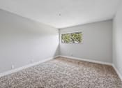 Thumbnail 34 of 45 - Spacious room with window at Ocean Villas Apartments, California