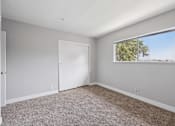 Thumbnail 28 of 45 - Room with Carpeted floor at Ocean Villas Apartments, California, 93033