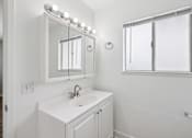 Thumbnail 35 of 45 - Bathroom with sink and mirror at Ocean Villas Apartments, California, 93033