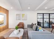 Thumbnail 21 of 45 - Living area with TV at Ocean Villas Apartments, Oxnard, CA 