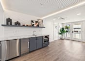 Thumbnail 41 of 45 - Kitchen with marble countertop at Ocean Villas Apartments, California