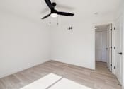 Thumbnail 37 of 45 - Room with ceiling fan at Ocean Villas Apartments, Oxnard, CA 