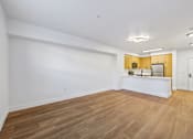 Thumbnail 35 of 60 - A room with wooden floors and a white counter.