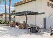 Thumbnail 8 of 45 - Outdoor patio with table and chairs at Ocean Villas Apartments, Oxnard, 93033