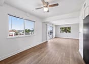 Thumbnail 45 of 45 - Living room with ceiling fan at Ocean Villas Apartments, Oxnard