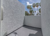Thumbnail 22 of 23 - the private balcony has views of the palm trees at Warner Center Townhomes, Canoga Park, CA