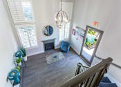Thumbnail 3 of 23 - a view of a living room from the top of a staircase at Warner Center Townhomes, California, 91303