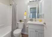 Thumbnail 8 of 47 - a bathroom with a sink toilet and a mirror at Skyline Heights Apartments, Daly City, California