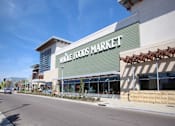 Thumbnail 15 of 45 - a store front of a market with a street in front of it at The Vines at Riverpark, LLC, Oxnard, CA 93036