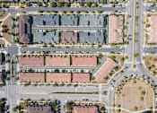 Thumbnail 18 of 45 - a birdseye view of a parking lot in a residential area at The Vines at Riverpark, LLC, Oxnard, CA