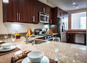 Thumbnail 1 of 45 - a kitchen with a sink and a counter top at The Vines at Riverpark, LLC, California, 93036