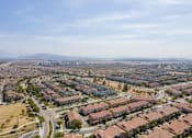 Thumbnail 21 of 45 - an aerial view of a city with houses and a highway at The Vines at Riverpark, LLC, California