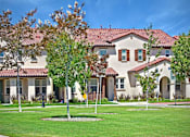 Thumbnail 22 of 45 - a large house with trees in front of it at The Vines at Riverpark, LLC, Oxnard, CA 93036