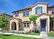 Thumbnail 25 of 45 - a house with a blue door and a lawn at The Vines at Riverpark, LLC, Oxnard