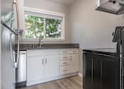 Thumbnail 9 of 14 - a kitchen with white cabinets and a window at The Pier at Sausalito, Sausalito, CA