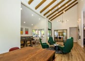 Thumbnail 9 of 25 - a game room with a table and chairs and a pool table at Parc Medallion LLC, Union City, CA 94587