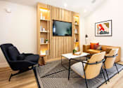 Thumbnail 10 of 25 - a living room with a couch and a television at Parc Medallion LLC, California, 94587