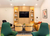 Thumbnail 11 of 25 - a living room with a table and chairs and a television at Parc Medallion LLC, Union City, 94587