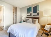 Thumbnail 13 of 25 - a bedroom with a white bed and a closet at Parc Medallion LLC, California, 94587