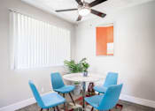 Thumbnail 16 of 25 - a dining room with a table and chairs and a ceiling fan at Parc Medallion LLC, Union City, CA