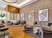 Thumbnail 8 of 60 - A modern living room with a grey couch and a large abstract painting on the wall. at Cirrus Redwood City Apartments, California, 94061
