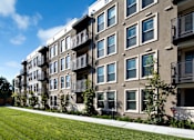 Thumbnail 5 of 60 - Apartment building with balconies and green lawn in front. at Cirrus Redwood City Apartments, California