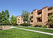 Thumbnail 13 of 21 - A playground area is located in front of apartment buildings. at The Maddox Sunnyvale Apartments, California