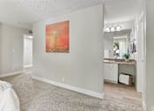 Thumbnail 38 of 90 - an empty bedroom with a painting on the wall at Summerwood Apartments, Santa Clara, CA 95050