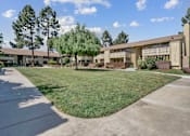 Thumbnail 70 of 90 - a building with a lawn and trees in front of it at Summerwood Apartments, Santa Clara, CA