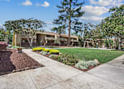 Thumbnail 53 of 90 - a sidewalk leading to a building with a lawn and trees at Summerwood Apartments, Santa Clara, 95050