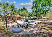 Thumbnail 46 of 90 - an outdoor patio with tables and chairs and trees at Summerwood Apartments, Santa Clara, 95050