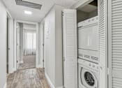 Thumbnail 40 of 90 - a washer and dryer in a laundry room with a closet at Summerwood Apartments, Santa Clara, 95050