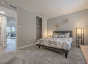 Thumbnail 18 of 40 - a bedroom with a bed and a door to a living room at Danville Park, Danville, California