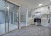 Thumbnail 22 of 40 - a renovated kitchen with white cabinets and stainless steel appliances  at Danville Park, Danville