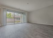 Thumbnail 25 of 40 - an empty living room with a sliding glass door to a balcony  at Danville Park, California, 94526