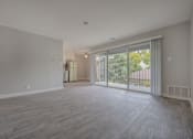 Thumbnail 36 of 40 - an empty living room with sliding glass doors to a balcony at Danville Park, Danville, CA