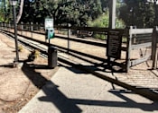 Thumbnail 20 of 40 - a fence and a sign at the entrance of a park  at Danville Park, Danville, California