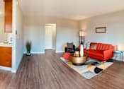 Thumbnail 13 of 25 - a living room with a couch and a kitchen at Element LLC, Sunnyvale, CA, 94086