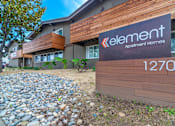 Thumbnail 8 of 25 - the front of an apartment building with a sign for lenient apartment homes at Element LLC, Sunnyvale, 94086