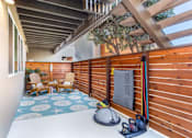 Thumbnail 17 of 25 - a patio with a wooden fence and a pair of shoes on the floor at Element LLC, Sunnyvale, CA